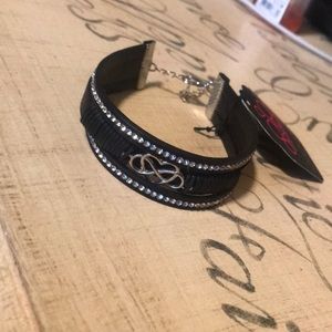a black leather paparazzi bracelet